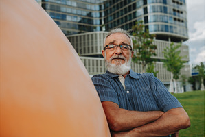 Confident senior man standing in the, a Person Photo by HalfPoint