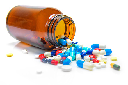 Pills spilling out featuring addiction, antibiotic, and antioxidants
