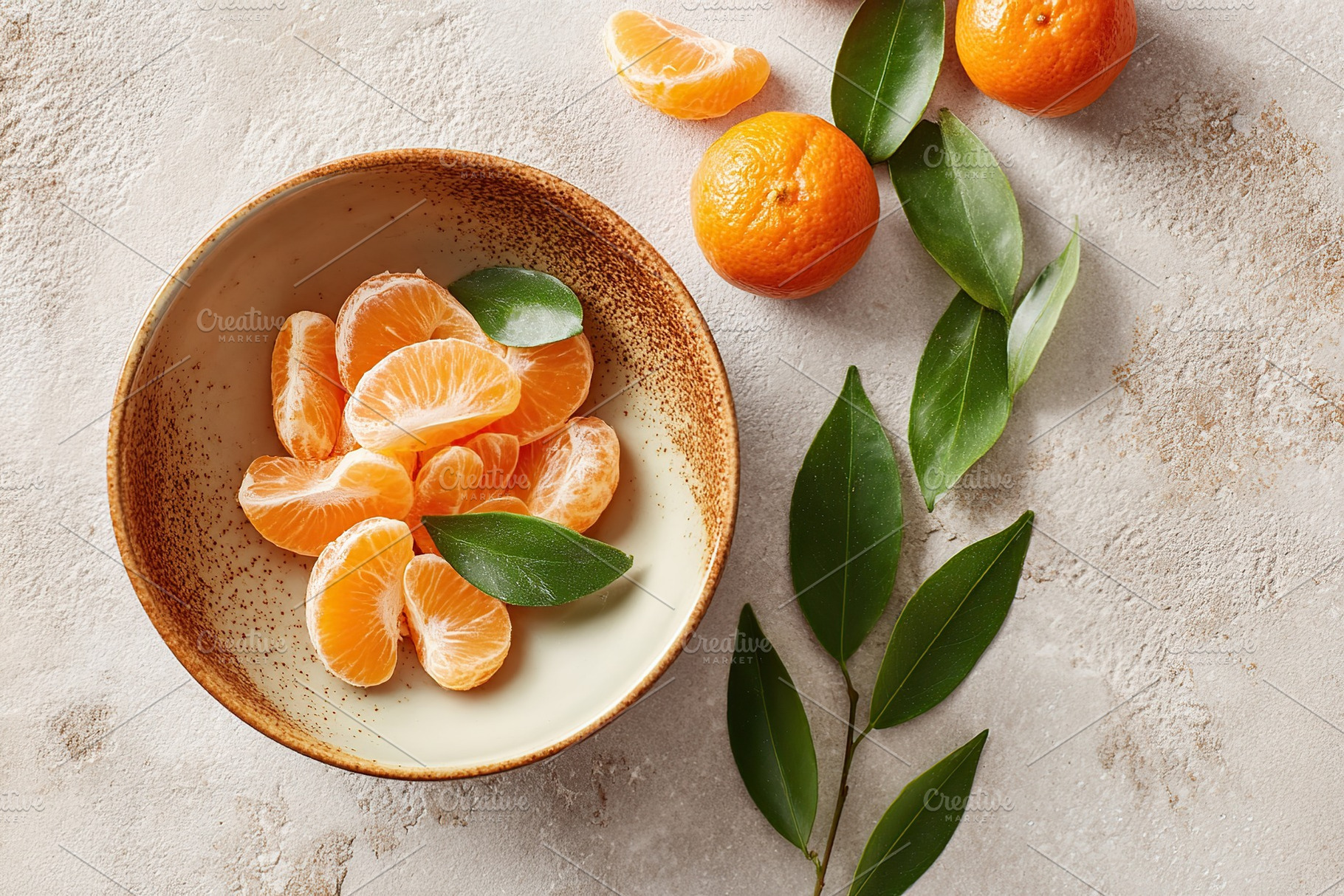 Fresh citrus slices in a ceramic dish with tangerines and green leaves arranged, a Food & Drink Photo by AlyaAnd