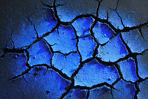 Details of a cracked matte black surface illuminated by blue light at close ran, a Background Photo by AlyaAnd