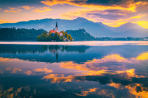 Magical sunrise with colorful clouds, an Architecture Photo by Alpine Dreams