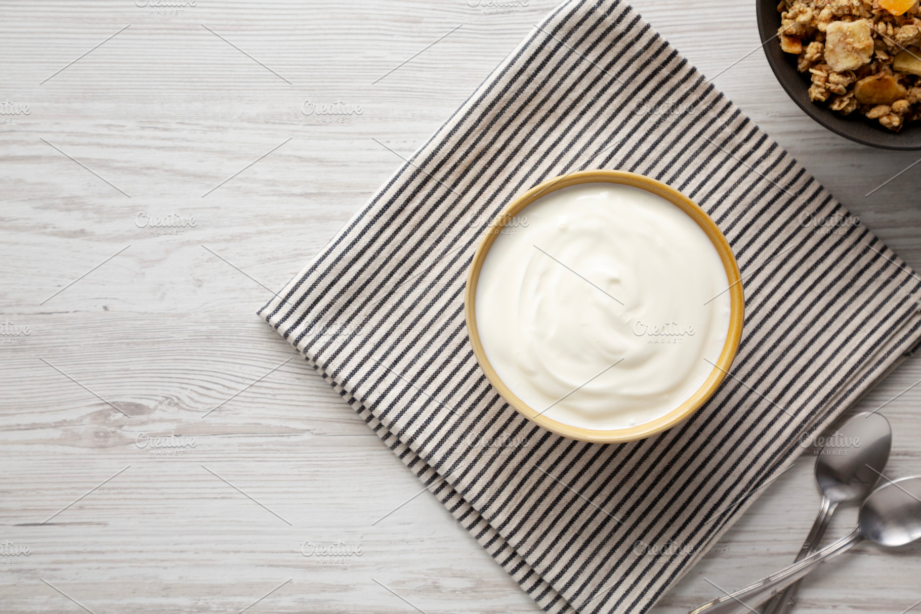Organic Whole Fat Greek Yogurt in a Bowl, top view. Copy space., a Food & Drink Photo by LiudmylaChuhunova