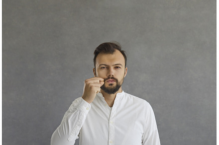 Serious caucasian man demonstrates a, a Person Photo by StudioRomantic