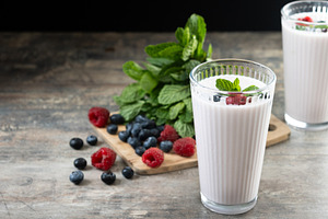 Fresh raspberry and blueberry smoothie on wooden table, a Food & Drink Photo by etorres69