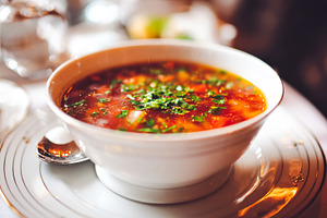 Hot vegetable soup with fresh herbs, an appetizer serving in a f, a Food & Drink Photo by Studio ANNA