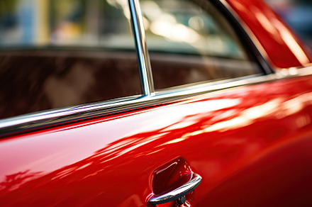 Closeup photo of a new red modern car, a Transportation Photo by AlyaAnd