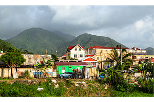 Colorful houses and mountains in, an Architecture Photo by Leonid Andronov