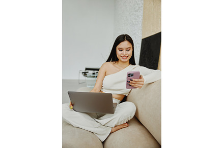 Young asian woman using mobile phone