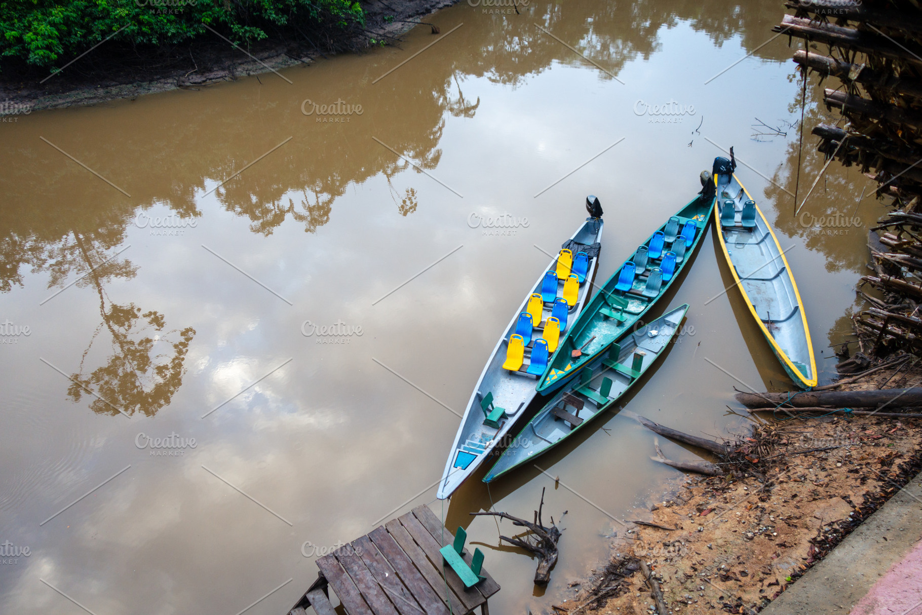Canoes on the calm waters of Cuyabeno Reserve, Ecuador, a Photo by GoodGoods