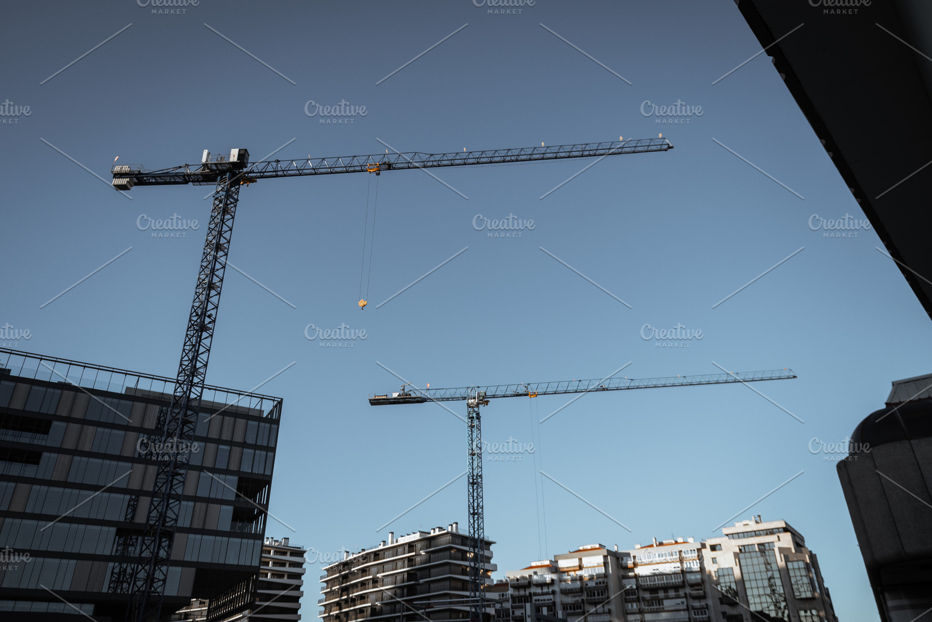 Tower Cranes Over City Buildings, an Industrial Photo by SkyNext