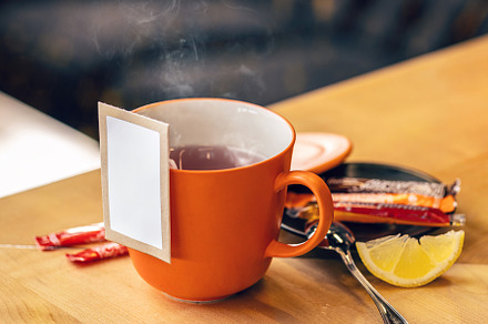 Ceramic cup with tea bag, a Photo by Grafvision photography