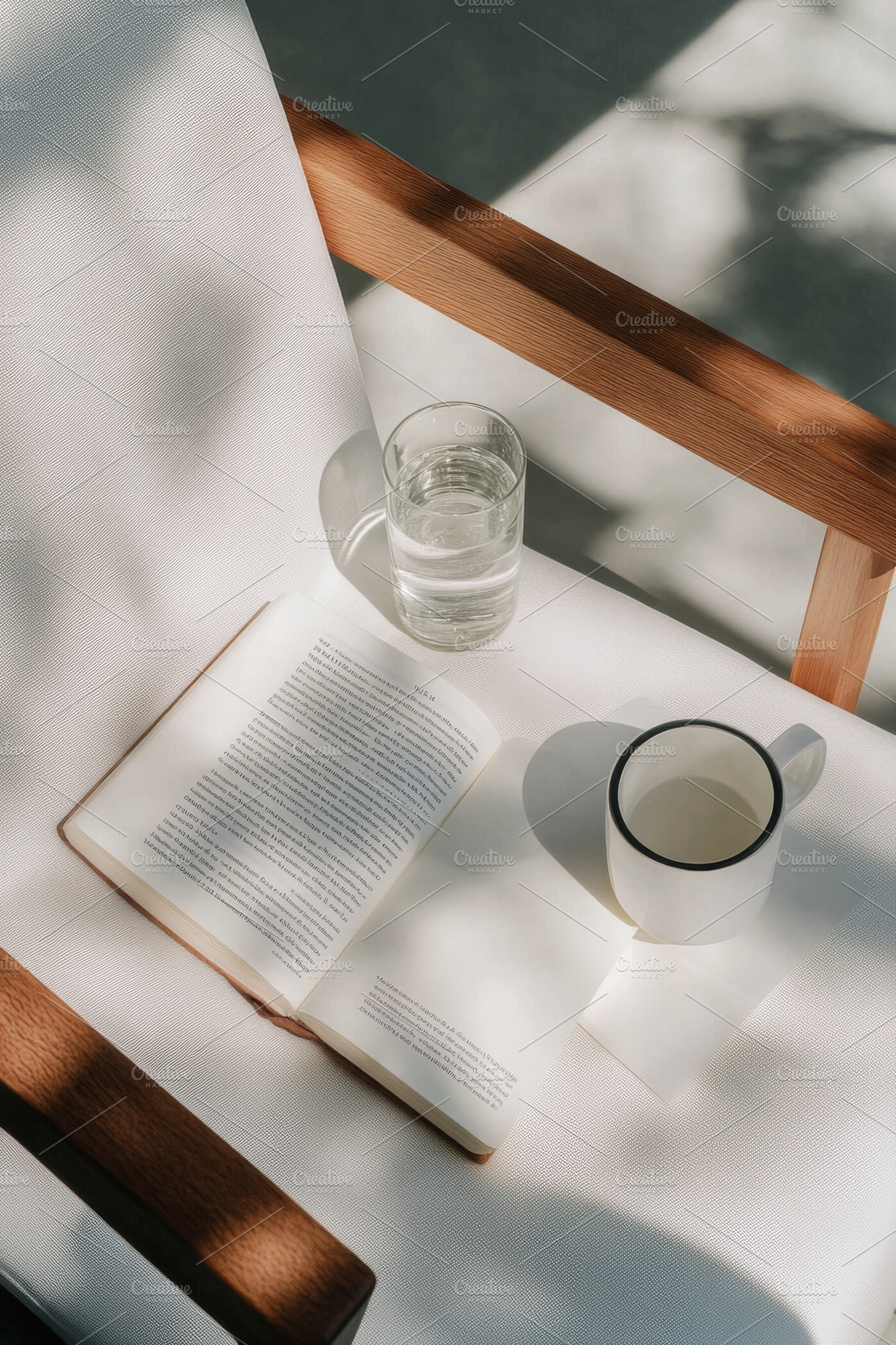 Empty chair with open book, notebook, a Photo by Dvoevnore photos