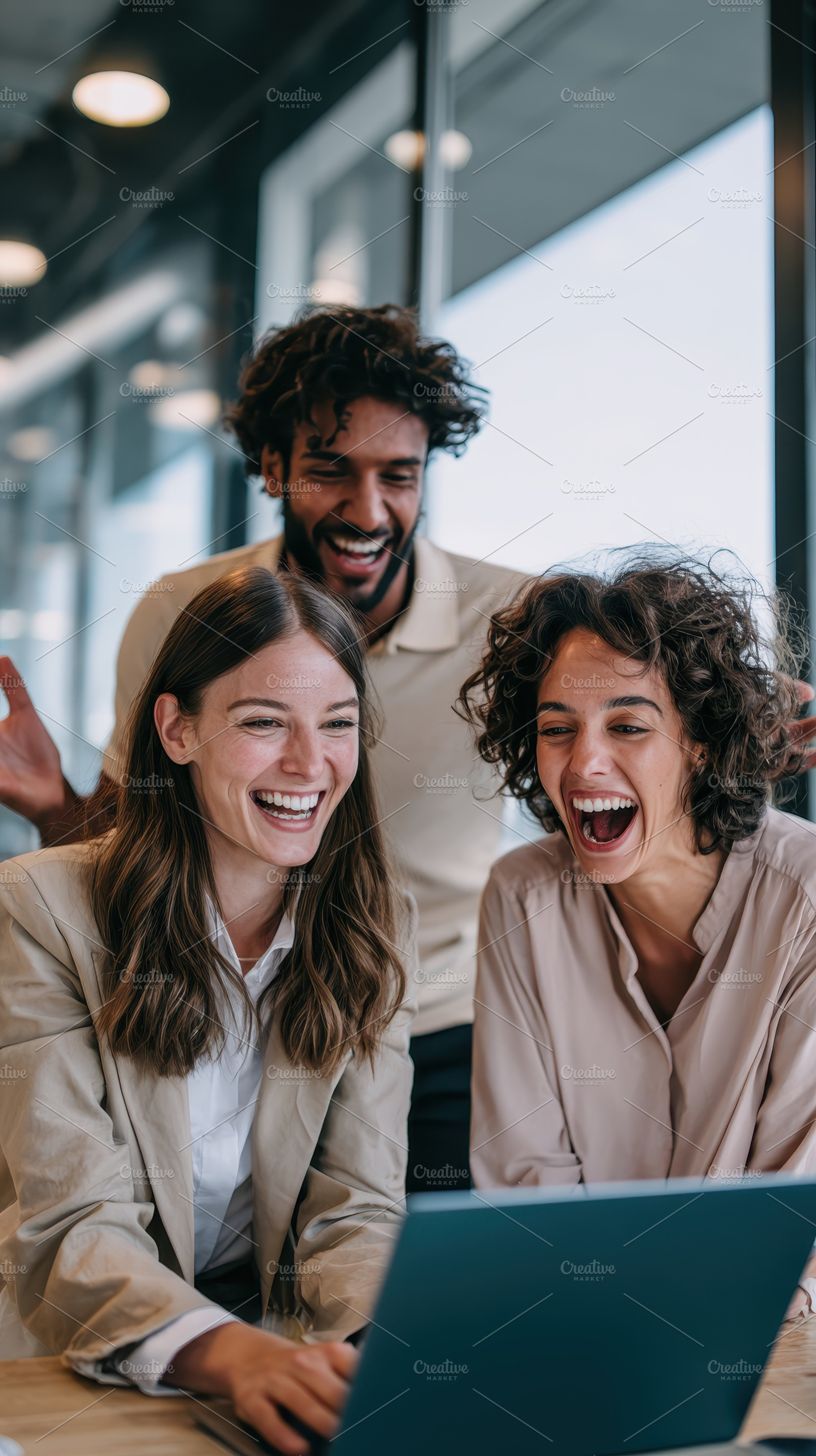 Happy diverse coworkers using laptop, a Photo by Pixeness Studio