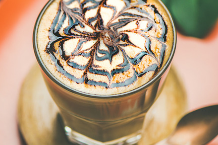 Latte coffee with chocolate sauce stock photo containing cappuccino and cup, a Food & Drink Photo by Foxys