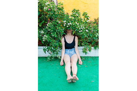 Thoughtful woman sitting alone, a Person Photo by Manu Reyes