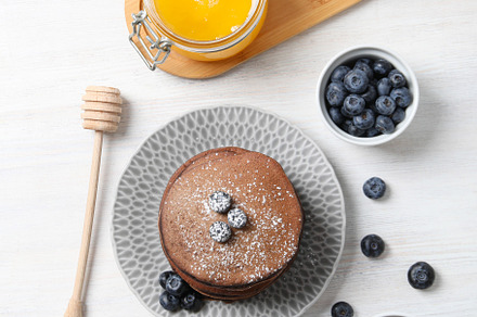 Concept of sweet food, chocolate pancakes, top view, a Food & Drink Photo by AtlasStudio PRO
