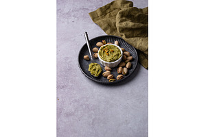 Sweet pistachio cream in a bowl, a Food & Drink Photo by Yulia Furman