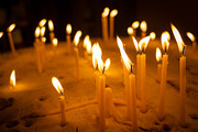 Burning candles with warm flames placed in a bed of sand, an Abstract Photo by GoodGoods (Thumbnail 1 of 2)