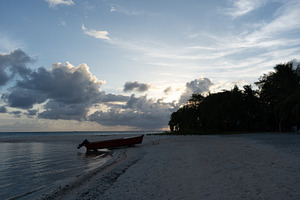 Serene sunset on a tropical beach in Tikehau, French Polynesia, a Nature Photo by GoodGoods