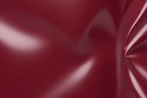 Deep maroon fabric draped elegantly on a surface, showcasing smooth texture and, a Photo by Kzara Visual Concepts