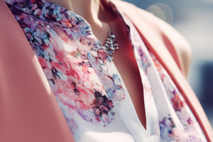 Woman wearing a stylish floral blouse and peach cardigan, showca, a Photo by Studio ANNA