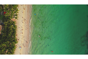 Tourists enjoying Cagban Beach in, a Nature Photo by Goinyk