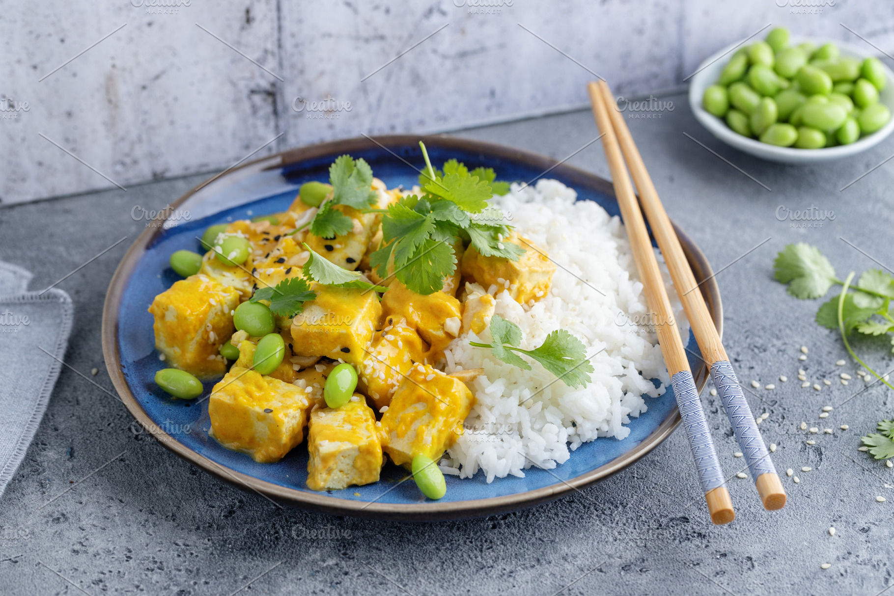 Healthy cooked tofu with sauce, a Food & Drink Photo by Valeria Art