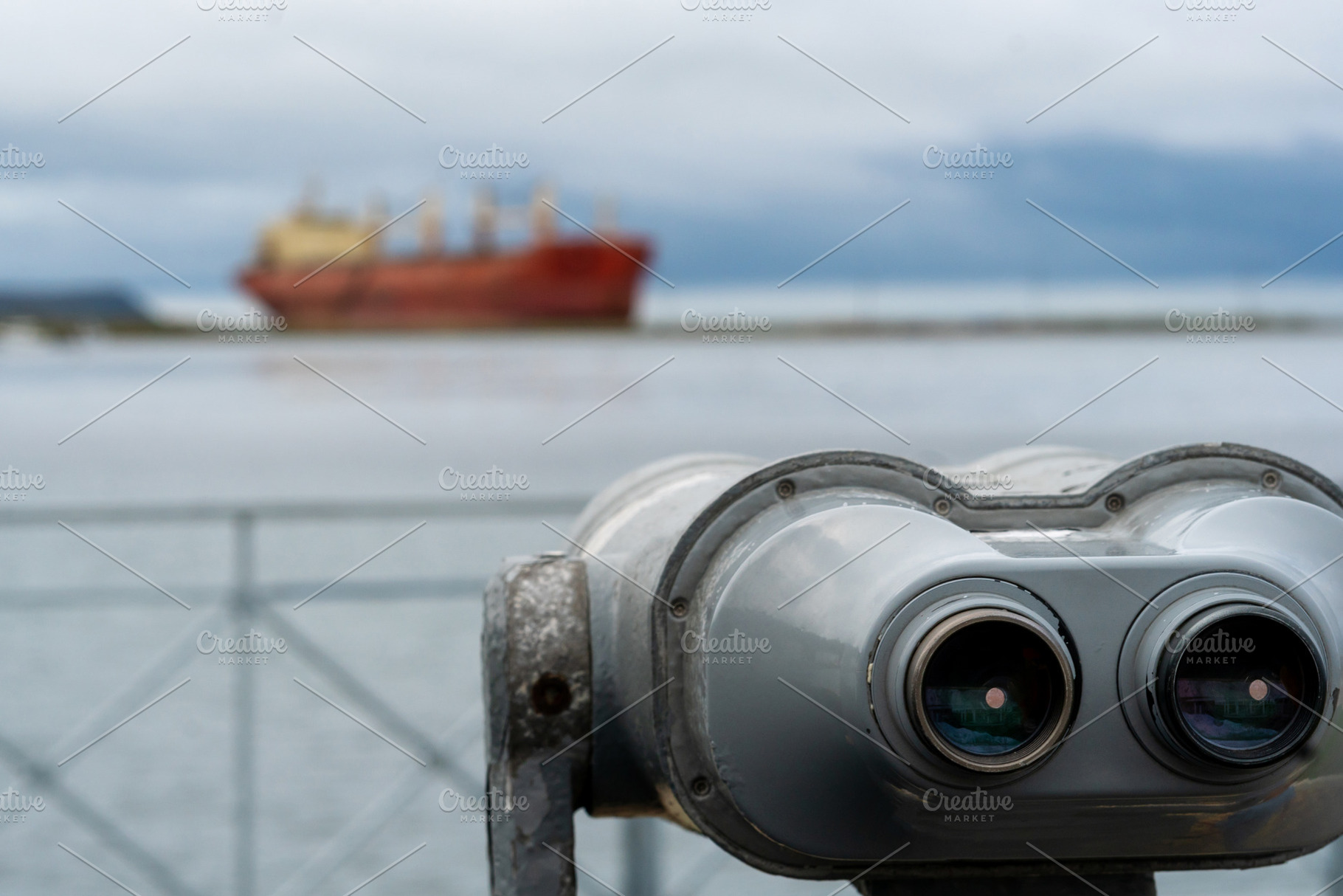 Closeup of binoculars facing distant, a Background Photo by Elena Vagengeim
