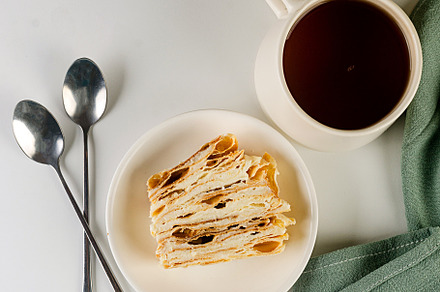 A piece of Napoleon cake. Layered cake with custard, a Food & Drink Photo by vimart