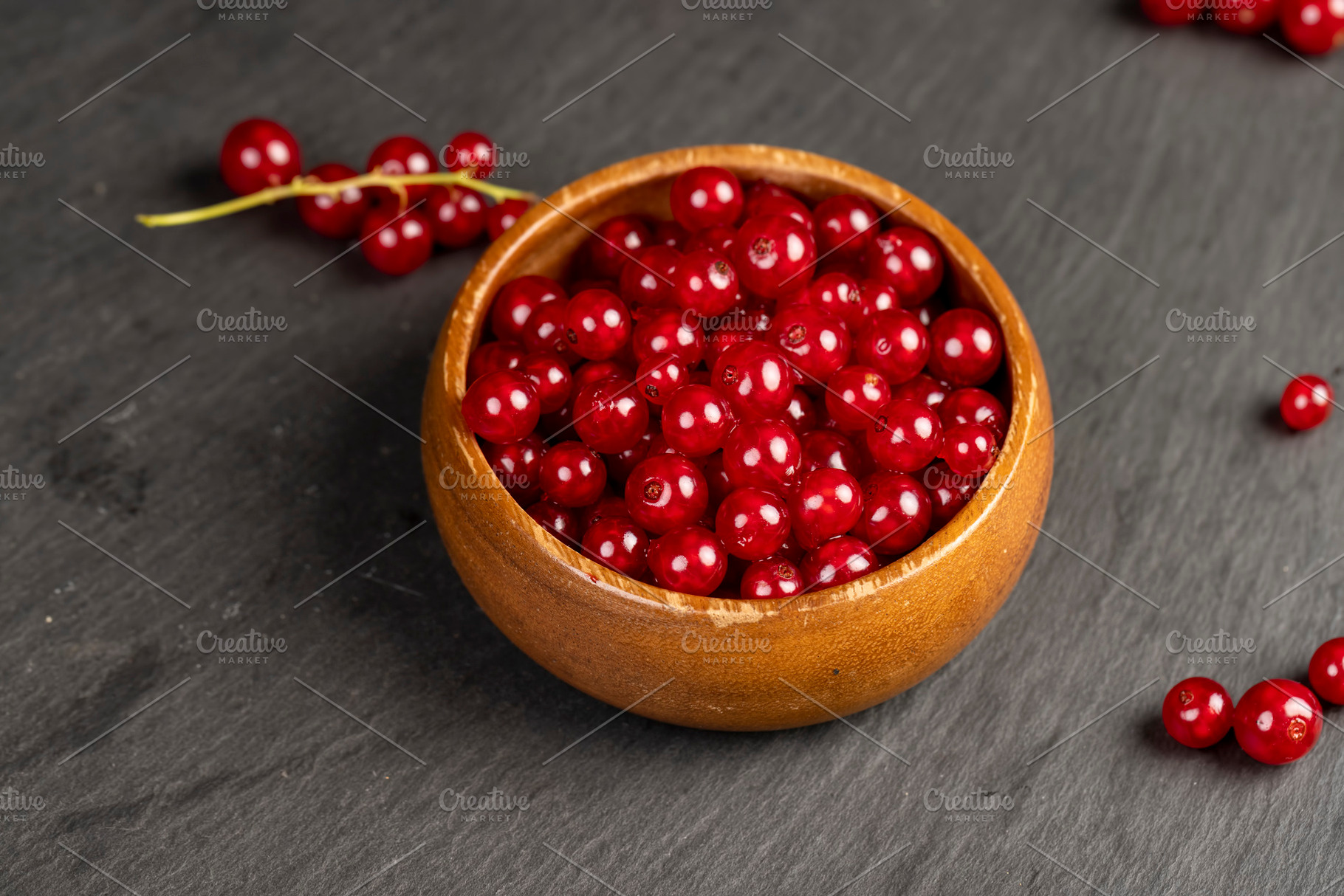 harvest small red currant berries on the kitchen table in a bowl, a Photo by rsoollAI