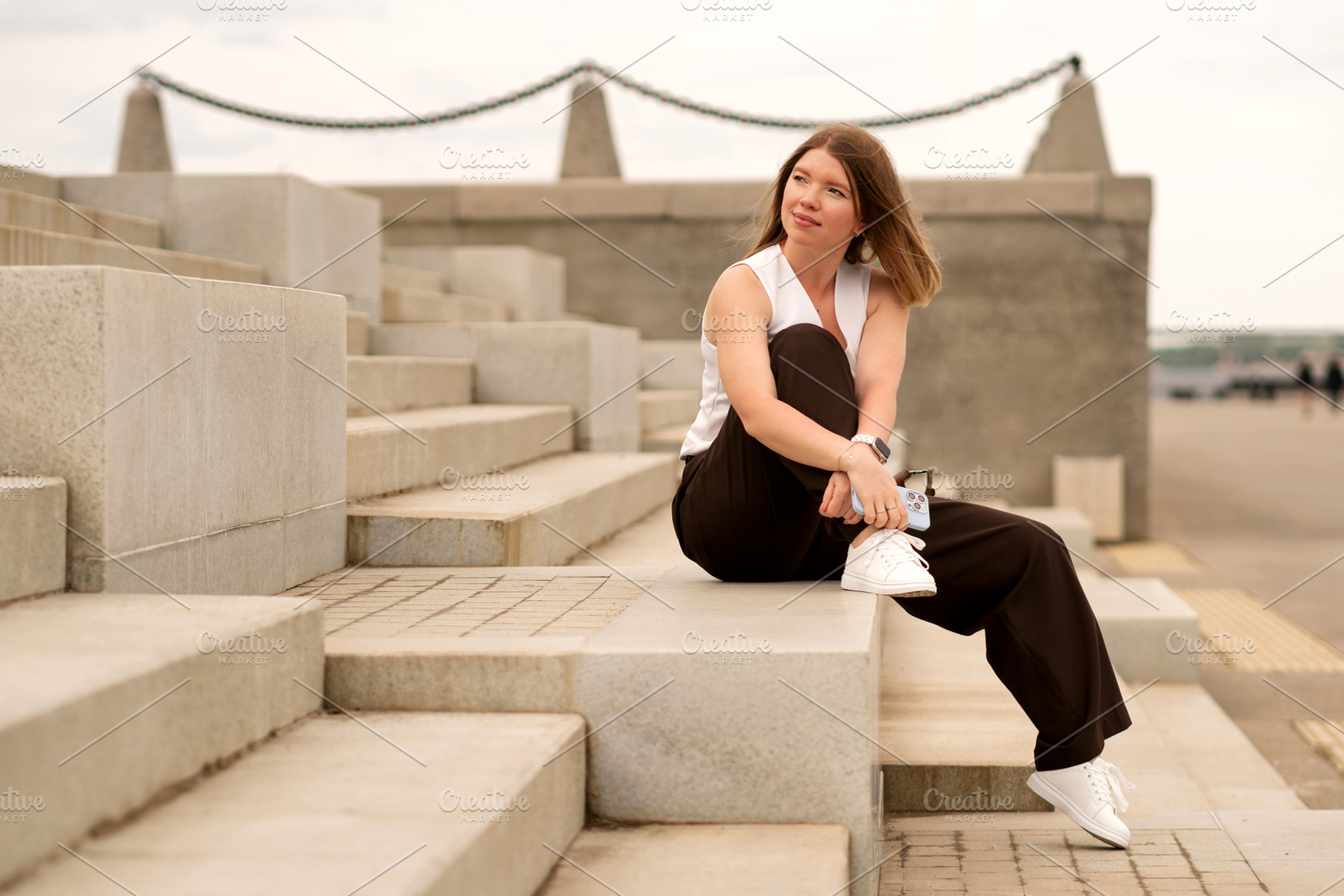 Young woman sitting on steps, a Person Photo by Elena Vagengeim