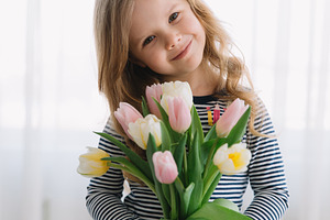Pretty little girl with tulips stock photo containing day and mother