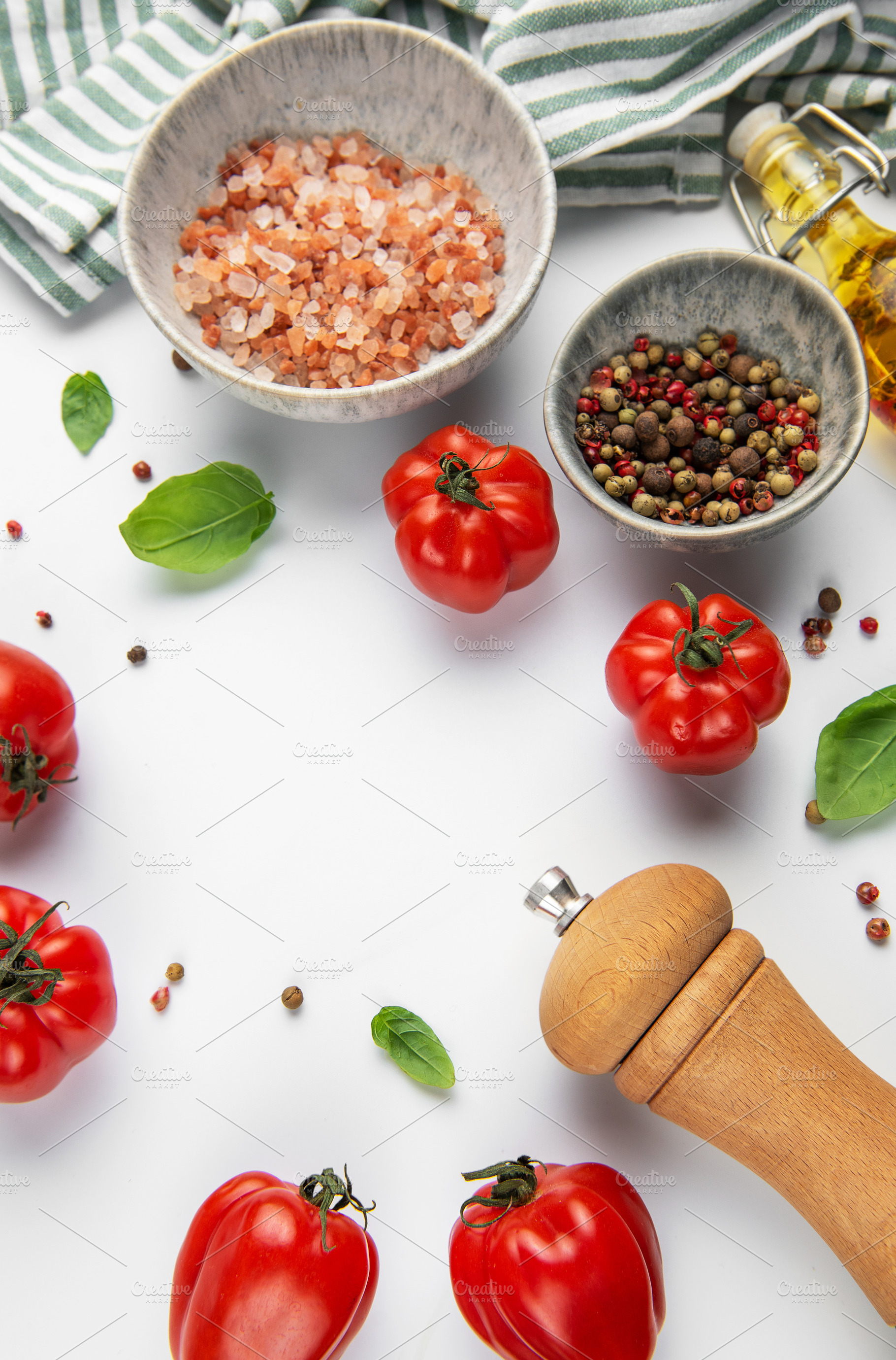 Fresh tomatoes with pink salt and peppercorns for cooking, a Food & Drink Photo by Olena Rudo