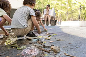 Children playing creatively outdoors, a Photo by Dvoevnore photos