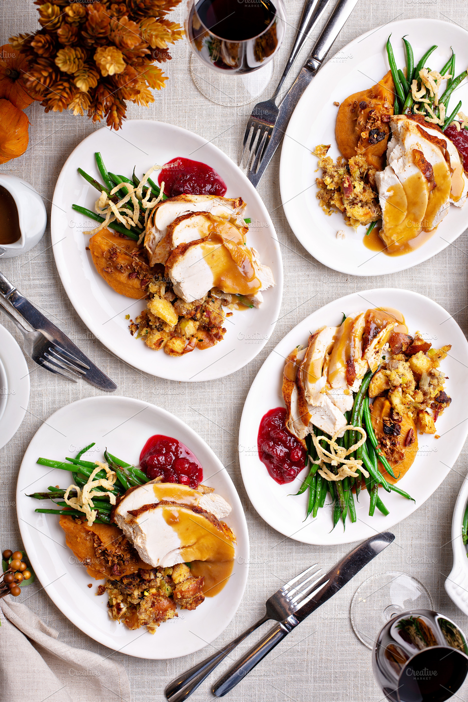 Traditional Thanksgiving plates with turkey and sides, a Food & Drink Photo by farwasser