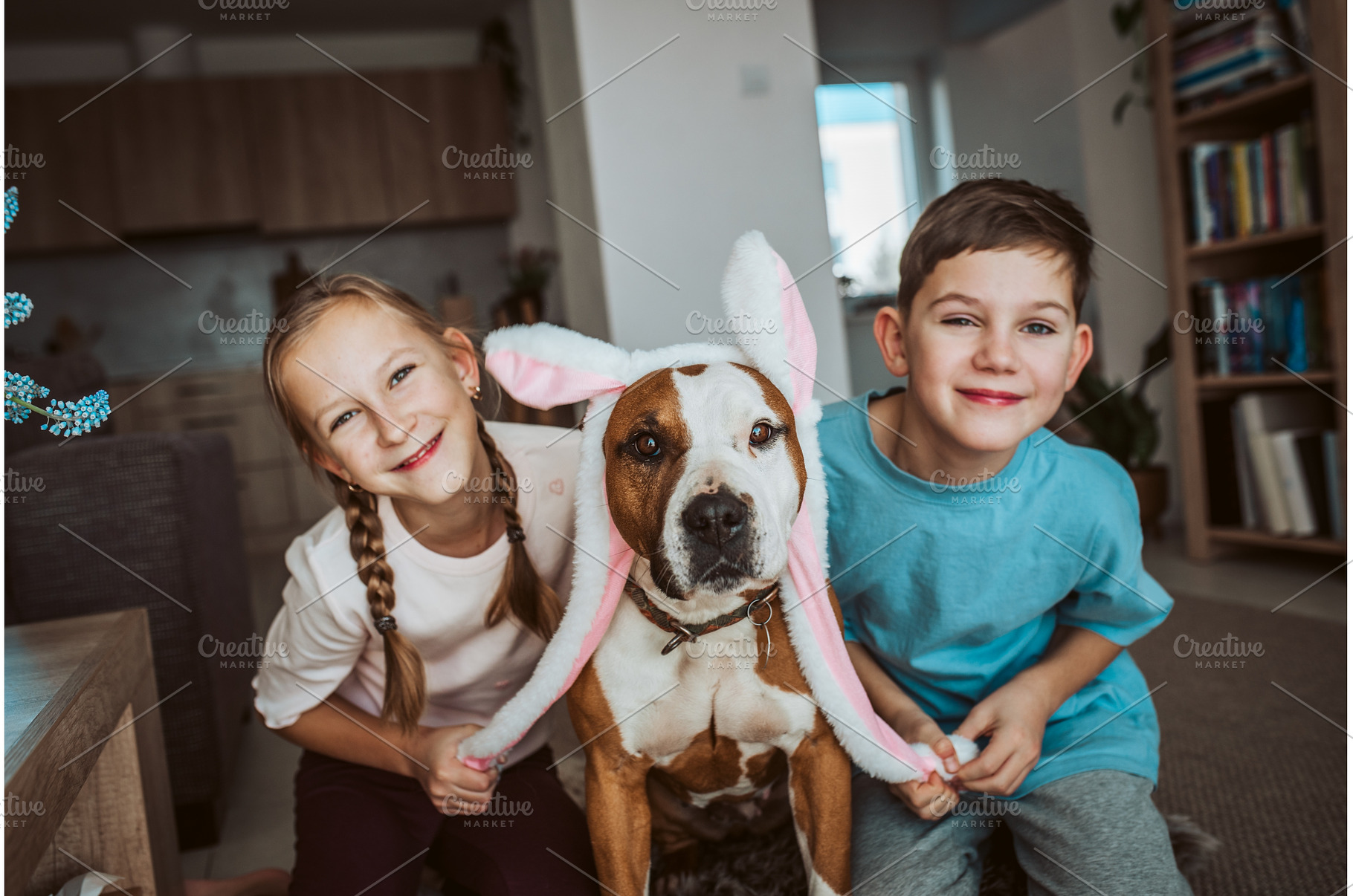 Boy, girl and dog wearing bunny ear, an Animal Photo by HalfPoint