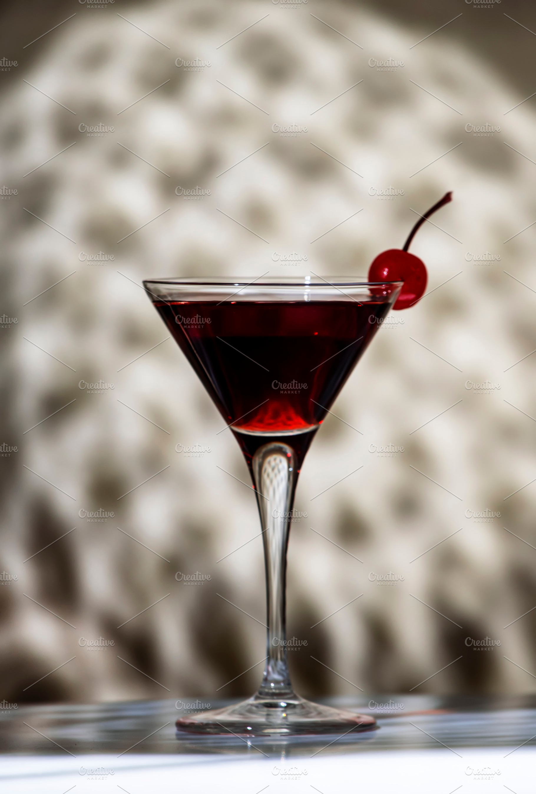 Black Manhattan cocktail with whiskey and red vermouth garnished, a Food & Drink Photo by 5PH