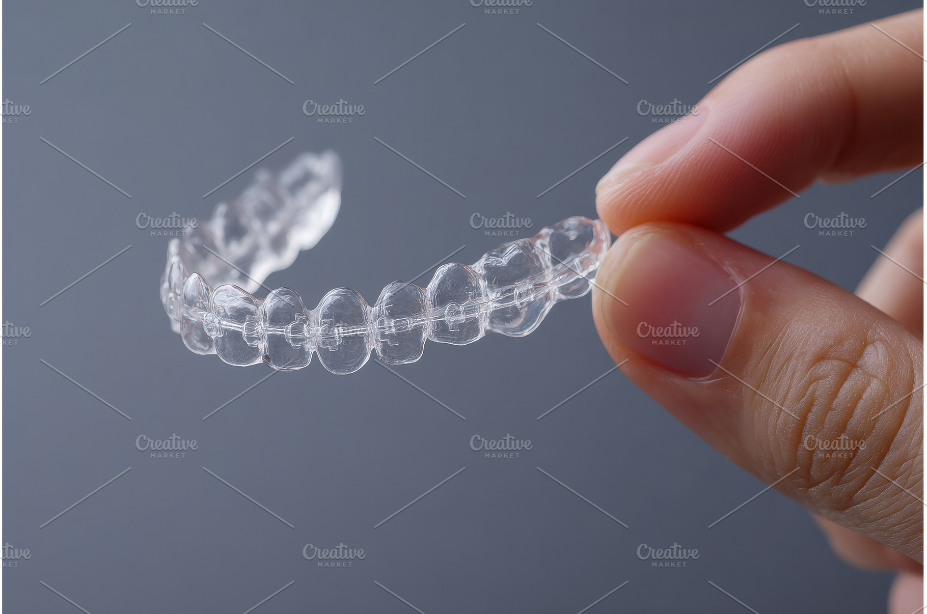 A woman is using an orthodontic, a Health & Medical Photo by ZinetroN
