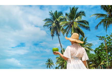 Girl on the beach drinks coconut, a Person Photo by yanadjana