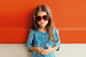 Beautiful little girl child in red h