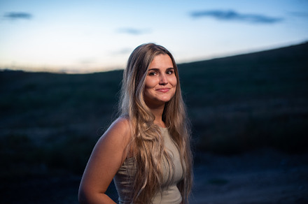Portrait of a blonde caucasian woman smiling while gets dark, a Person Photo by Iván Moreno STOCK PHOTO
