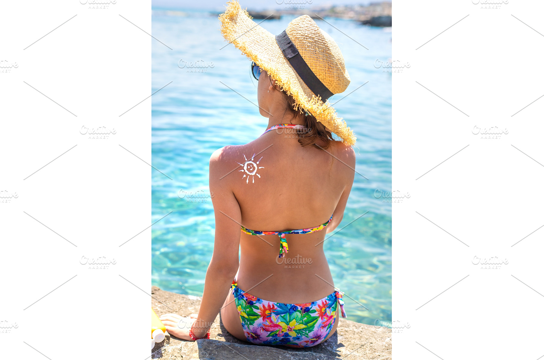 The child has sunscreen on his back, a Holiday Photo by yanadjana
