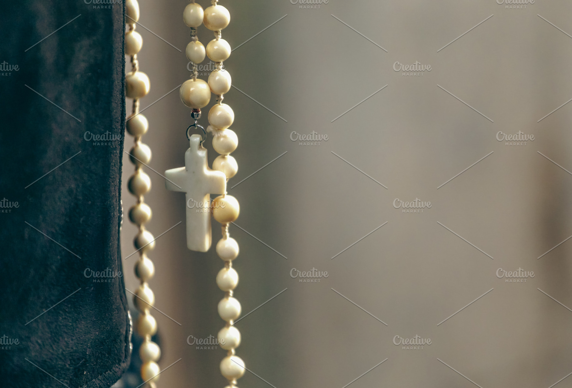 White rosary with cross hanging, faith and spirituality concept, a Holiday Photo by Antonio Gravante Market