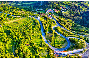 Aerial view of a winding road in, a Nature Photo by Leonid Andronov