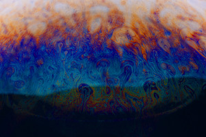 Vivid blue, orange, and yellow swirling patterns create a dynami, a Background Photo by Ales Munt