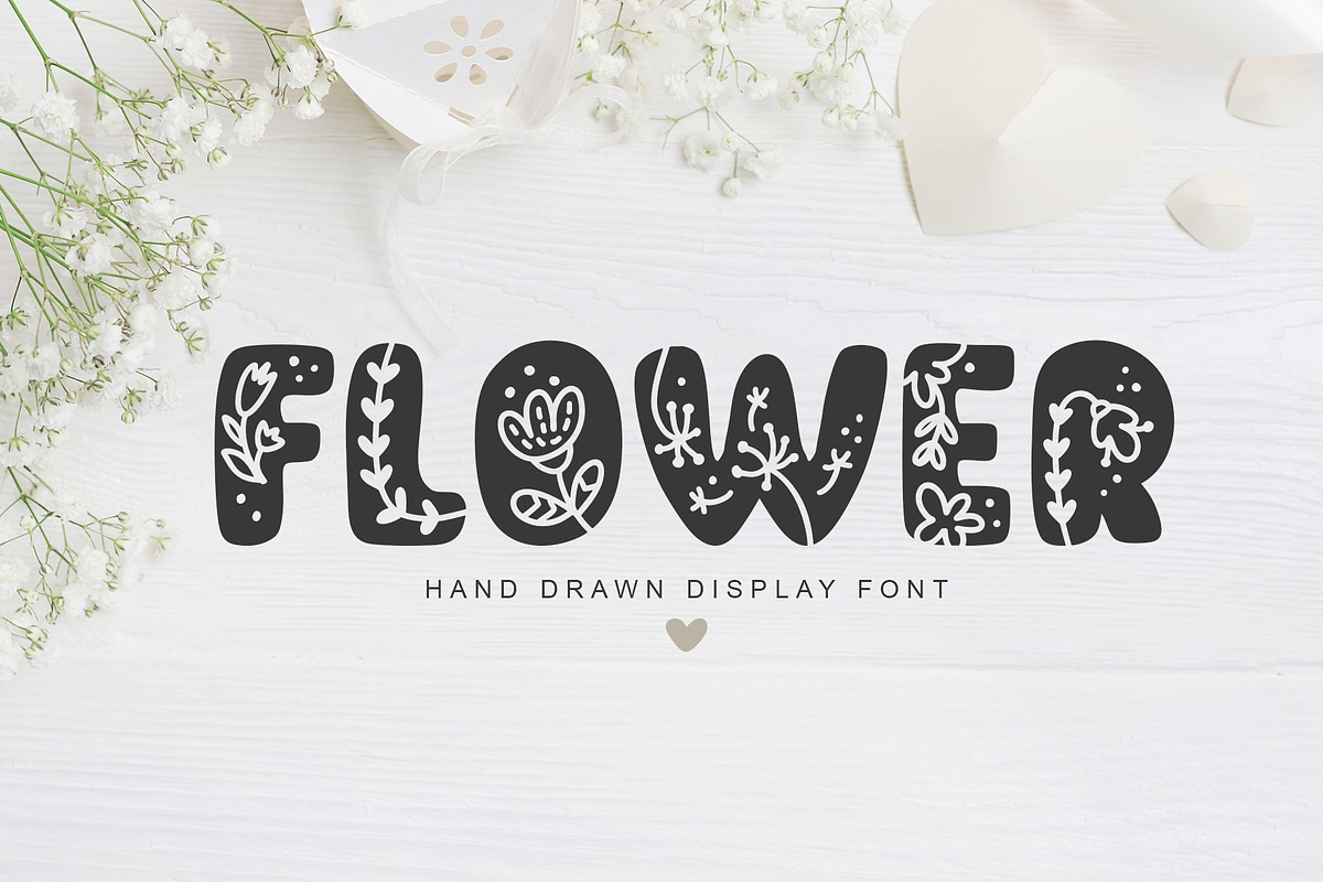 Flower Hand Drawn display Font, a Script Font by Happy Letters (Photo 1 of 10)