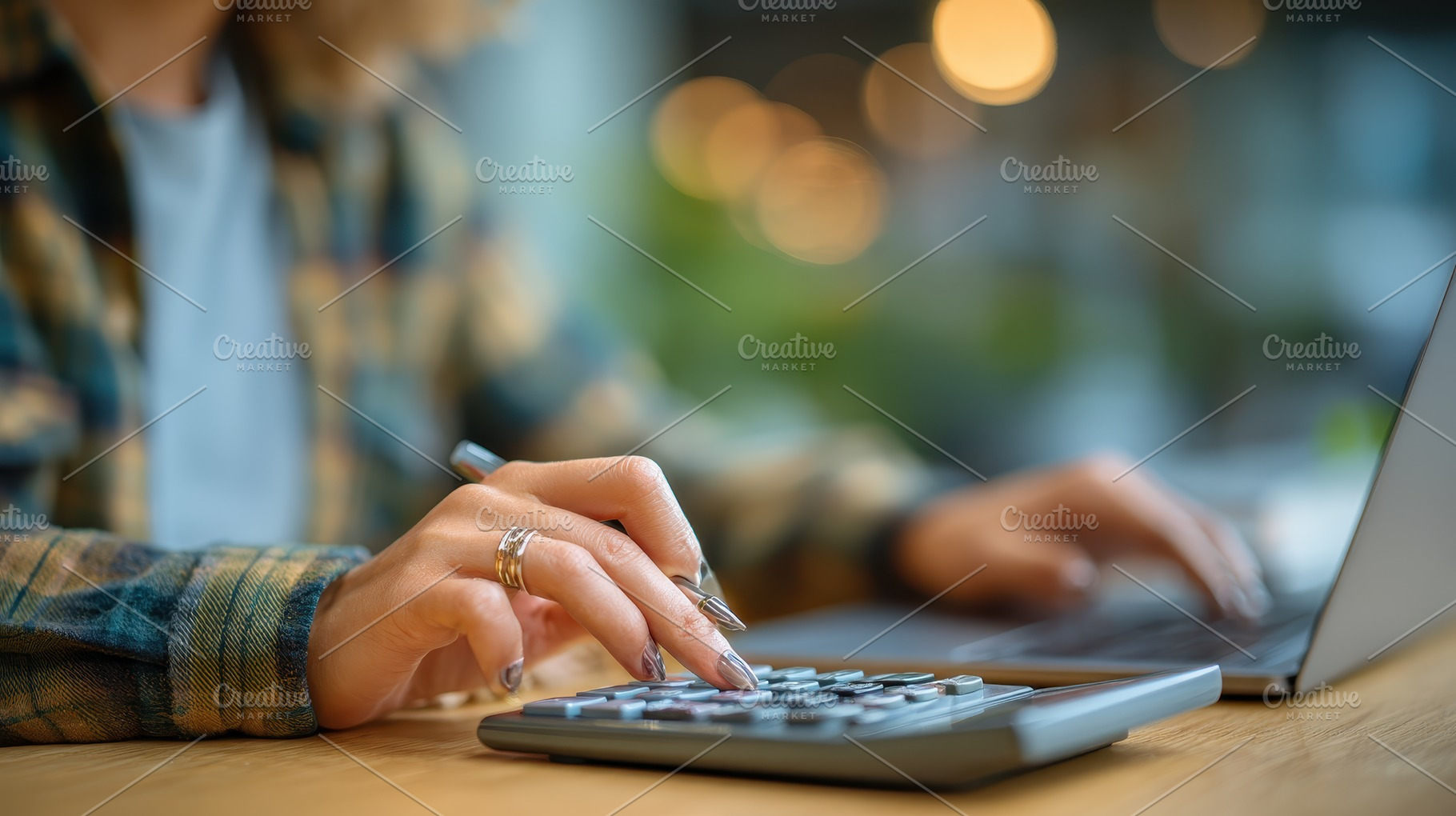 Woman using calculator and laptop fi, a Photo by Pixeness Studio
