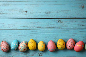 Easter Wooden Planks Table, a Holiday Photo by VetalStock