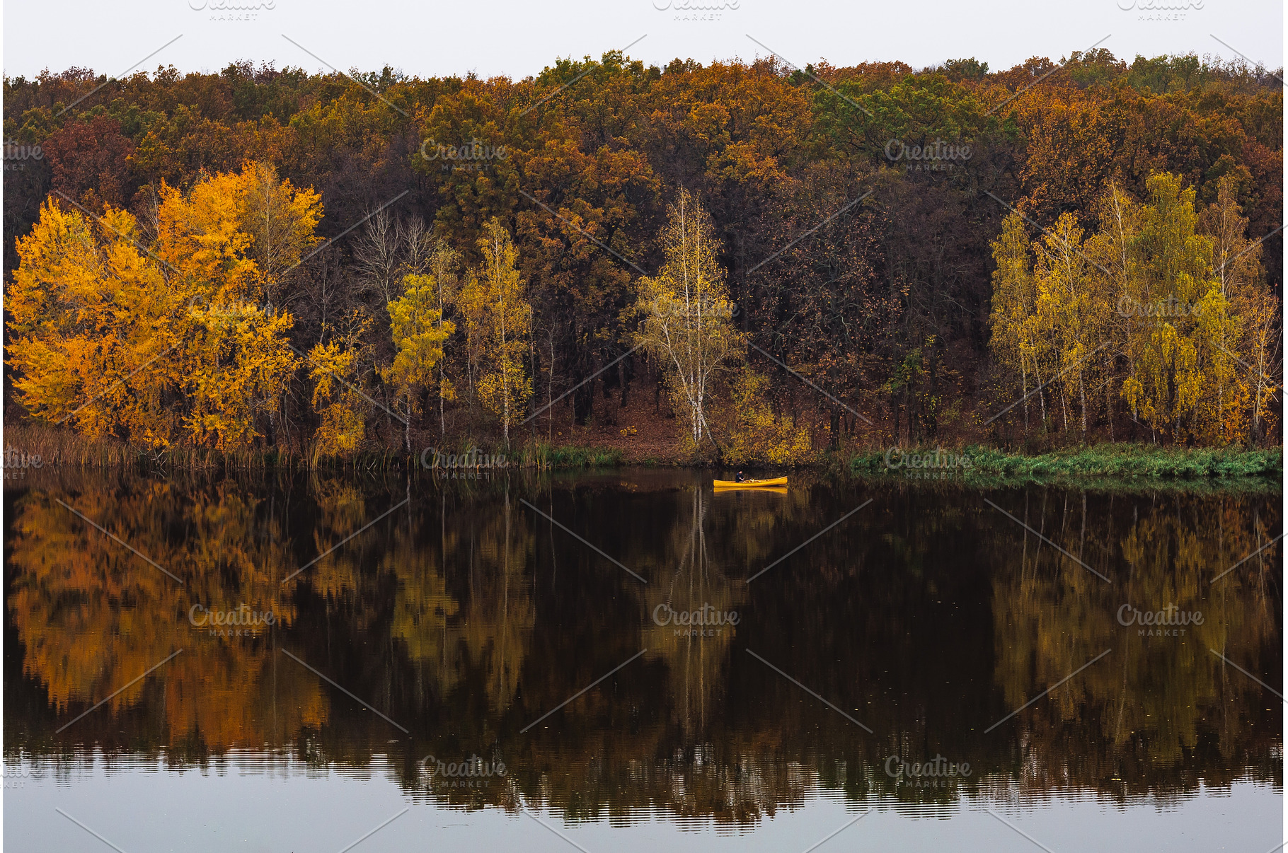 Yellow kayak on a calm lake, a Nature Photo by Red Hot Chili Pepper Shop