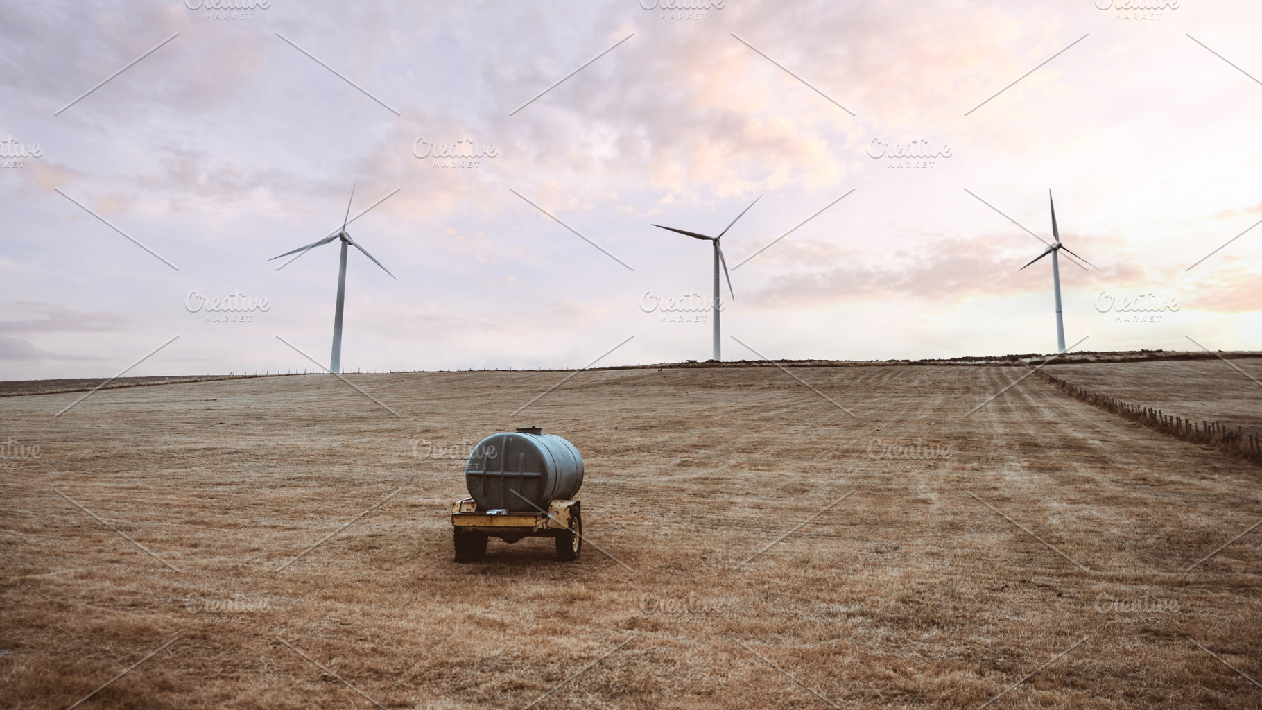 Wind turbines at sunset field, an Industrial Photo by SkyNext